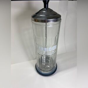 Barbicide disinfectant glass jar